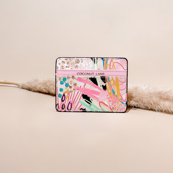 Abstract Vibes card holder from Coconut Lane, featuring a bold pattern, upright on a neutral surface with pampas in the background.