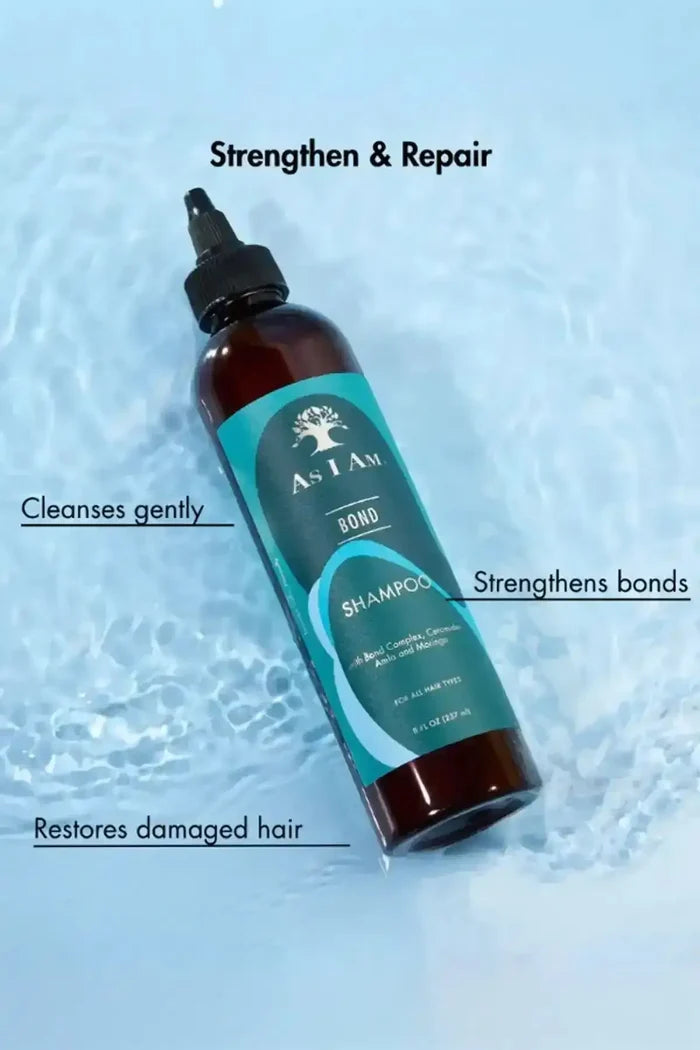 As I Am Bond Shampoo bottle in water, summarizing its benefits: cleanses gently, strengthens bonds, and restores damaged hair.
