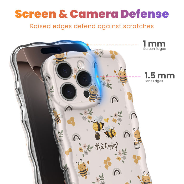 A phone case with a wavy edge design featuring floral prints and bees, held in a person's hand.