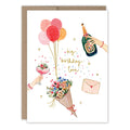 Greeting card with illustrations of balloons, flowers, a bottle of champagne, and hands holding a glass and envelope.