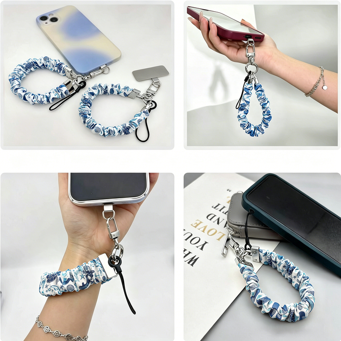 A Blue Lagoon scrunchie phone wrist strap with a blue and white sea turtle and ocean design attached to a matching Wavy Luxe case on a blue starfish background.