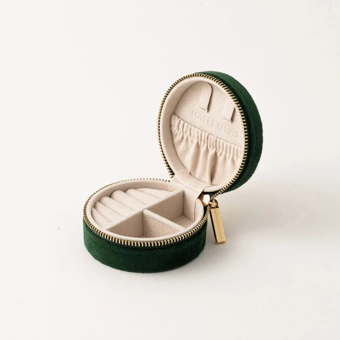Green jewelry box with beige interior on a white background
