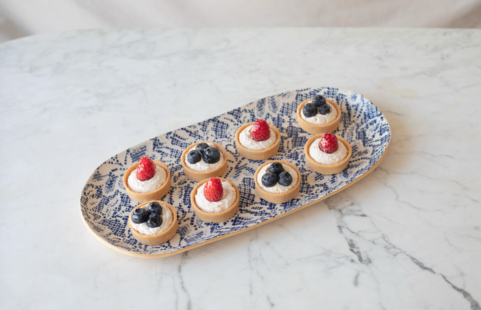 Stoneware tray with blue and white flower design.