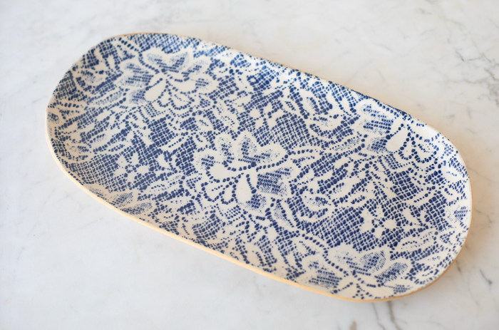 Stoneware tray with blue and white flower design.