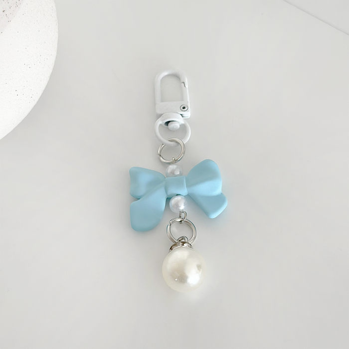 Blue keyring with a satin bow and pearl charm from Coconut Lane.
