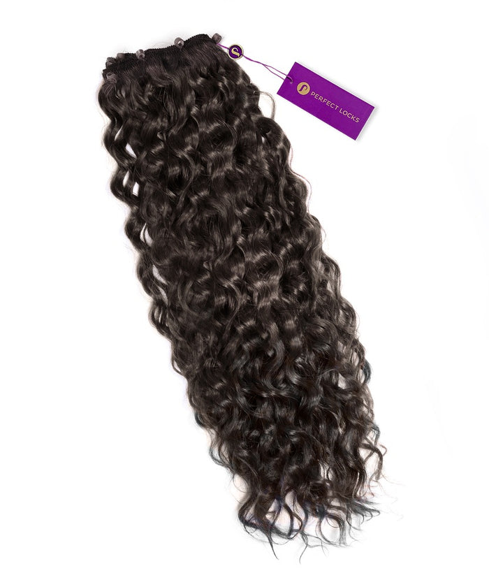 A long bundle of chocolate brown Curly Beaded Weft Rows human hair extensions from Perfect Locks with a purple tag on a white background.#color_natural-black-(1B)