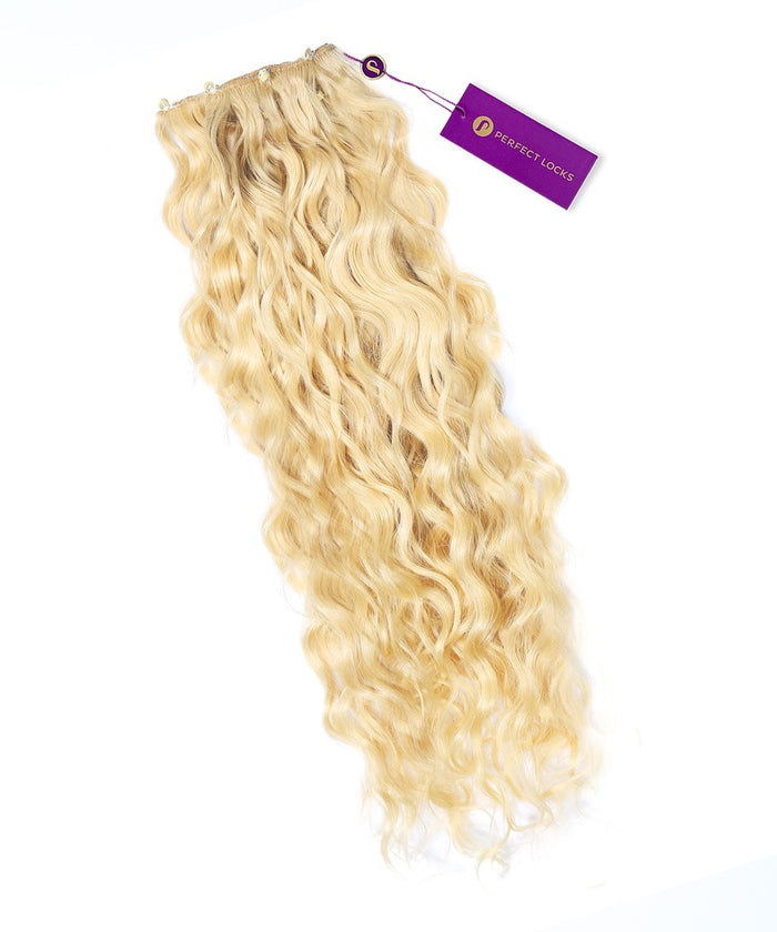 A bundle of platinum blonde Curly Beaded Weft Rows from Perfect Locks, featuring sewn wefts and a purple Perfect Locks tag attached.#color_platinum-blonde-(613)