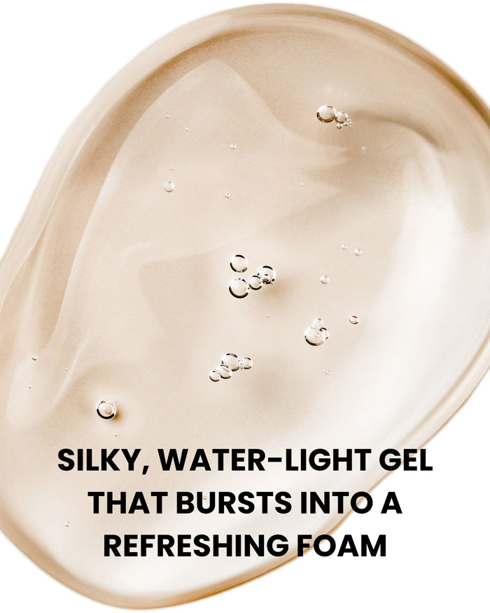 Foaming gel with bubbles on a creamy surface