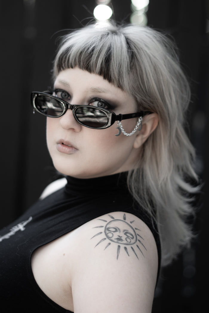 False Idol Sunglasses worn by model, black alternative fashion eyewear