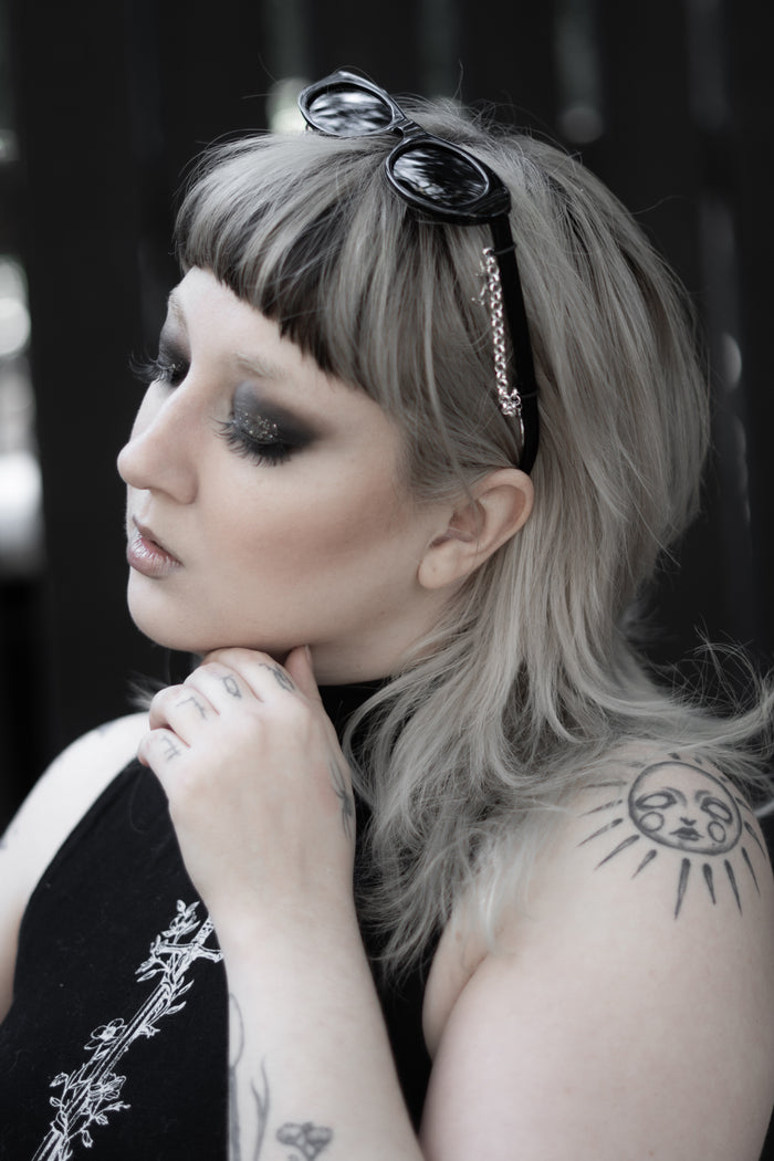 False Idol Sunglasses worn by model, black alternative fashion eyewear
