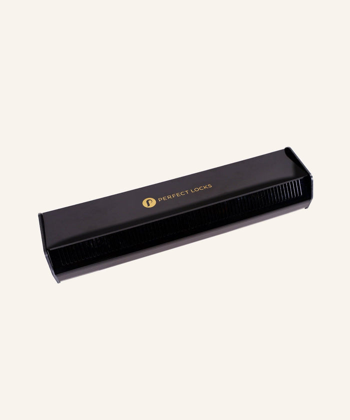 A black rectangular comb case featuring the Perfect Locks logo in gold on top, set against a plain beige background.