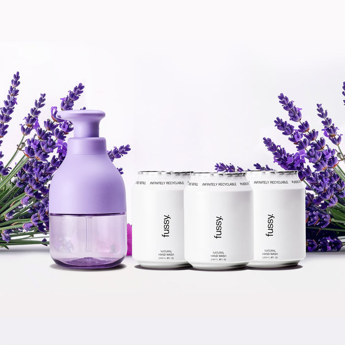 Fussy's Natural Body Care gift set in Cloud Nine Fresh Cotton scent, set against a backdrop of gift boxes set on a white fluffy surface.