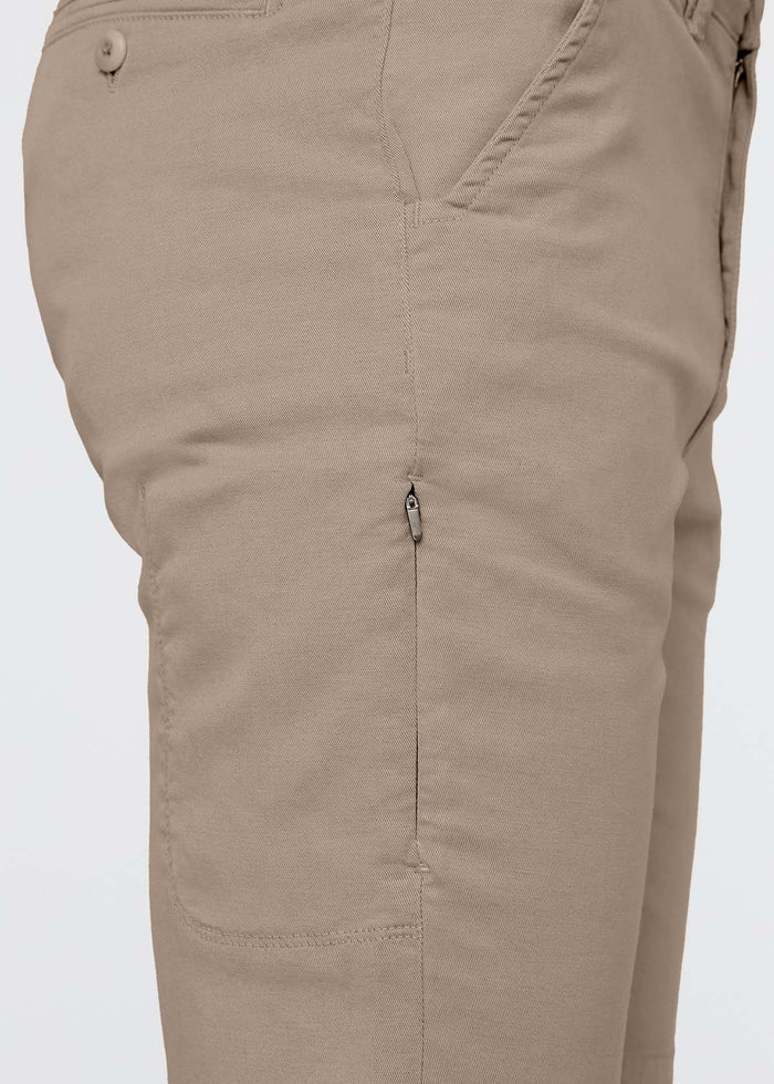 Sandstone-colored shorts with button waistband, side pockets, and ventilation eyelets on thighs.