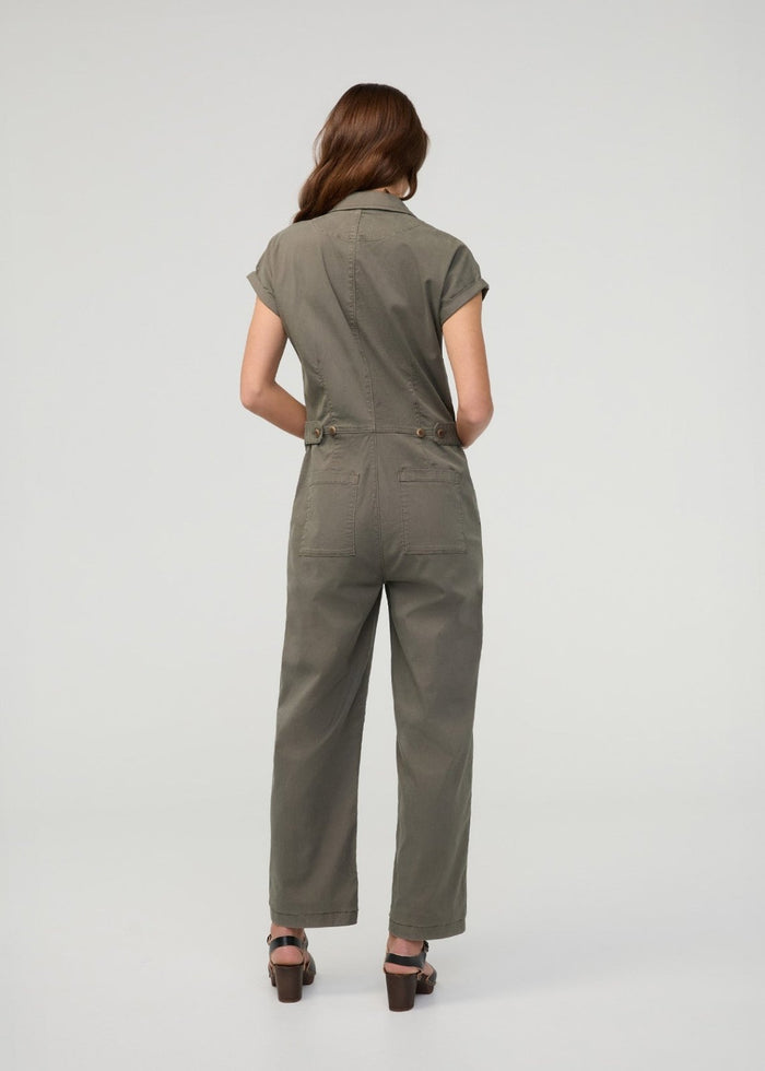 Thyme boiler suit with short sleeves, button front, chest pockets, and wide-leg pants, shown on model from back view.