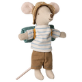A toy mouse dressed in a striped shirt and pants, with a hat on its head, holding a sleeping bag, and equipped with a backpack.