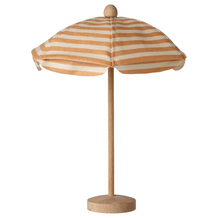 Striped umbrella with wooden base on a white background