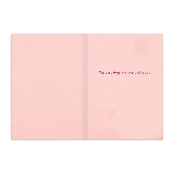 Open card with text 'The best days are spent with you' on a pink background