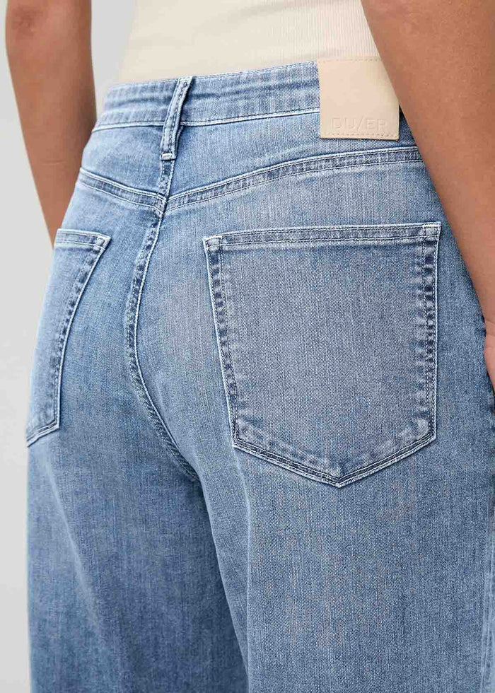 Light stone wash high-rise straight denim with back pockets, viewed from rear waist detail.