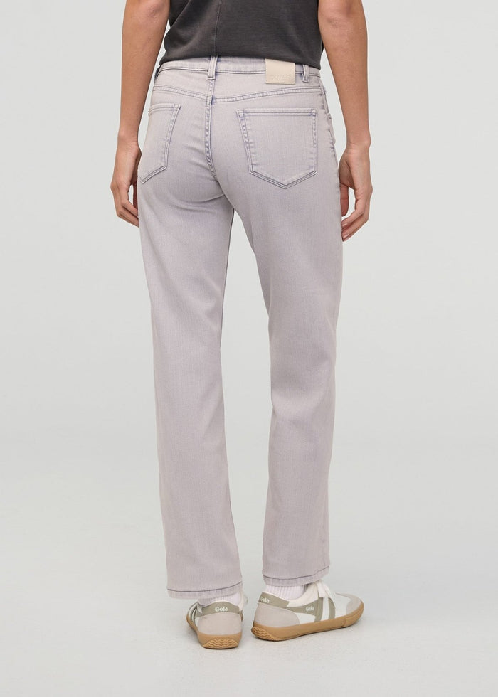 Light purple faded denim jeans with straight leg fit and back pockets, worn with cream and tan sneakers.
