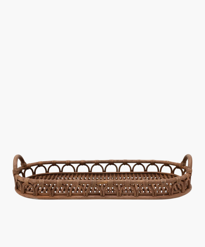 An oval hand-woven rattan tray with rounded handles on each side, featuring an intricate woven pattern. The warm brown color exudes a rustic, natural charm. | SW Home