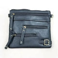 Black PU leather sling bag with adjustable strap and multiple zip compartments