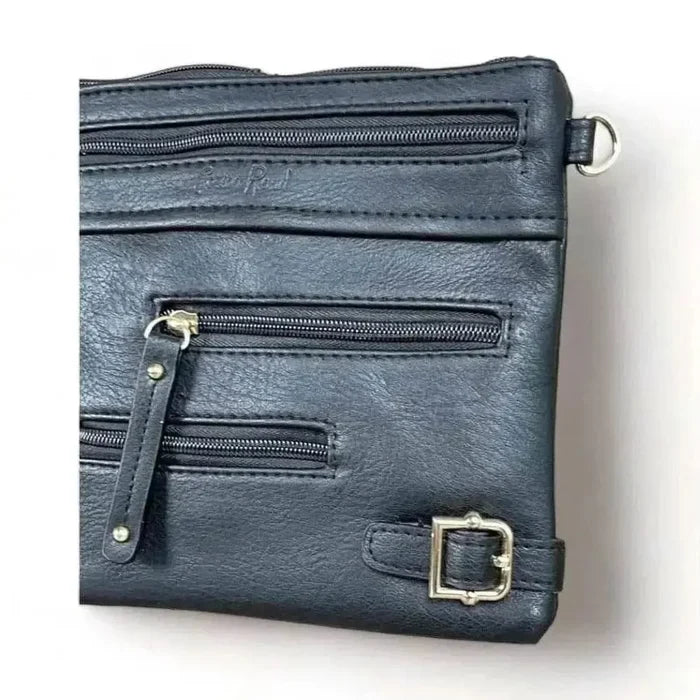 Black PU leather sling bag with adjustable strap and multiple zip compartments