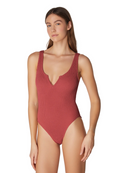 Woman wearing a red swimsuit on a white background