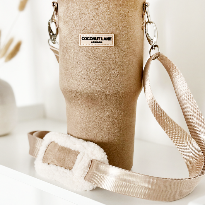 Nude Coconut Lane tumbler carry case with strap and fuzzy pad, sized for a Stanley Quencher 40oz travel mug.