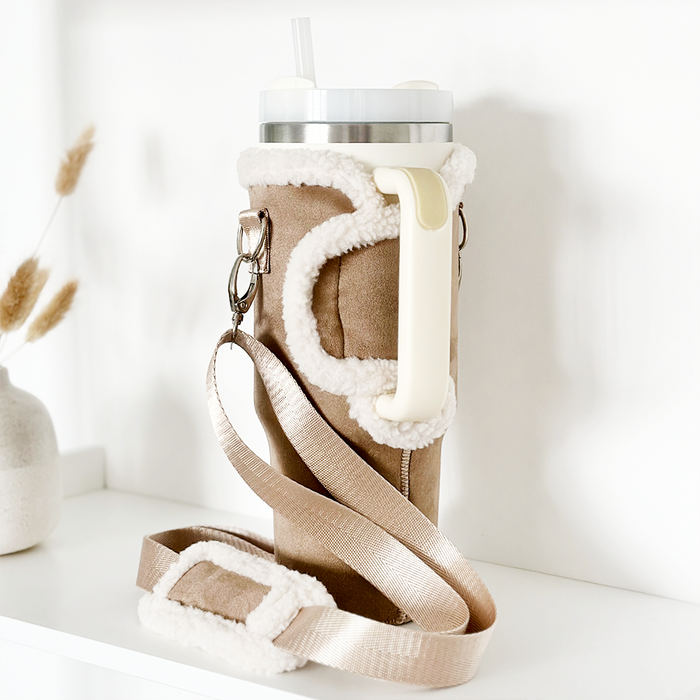 Nude Aviator Coconut Lane tumbler carry case with handle and strap, sized for 40oz, displayed on a shelf.