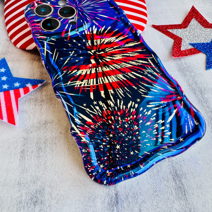 Dark blue wavy iPhone case featuring bright red, white, and blue fireworks display held in hand.
